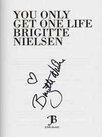 Brigitte-Nielsen-signed-autobigraphy-you-only-get-one-life-cover movie memorabilia autograph signature